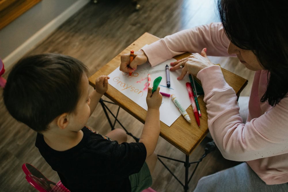 nanny with toddler providing childcare in the home